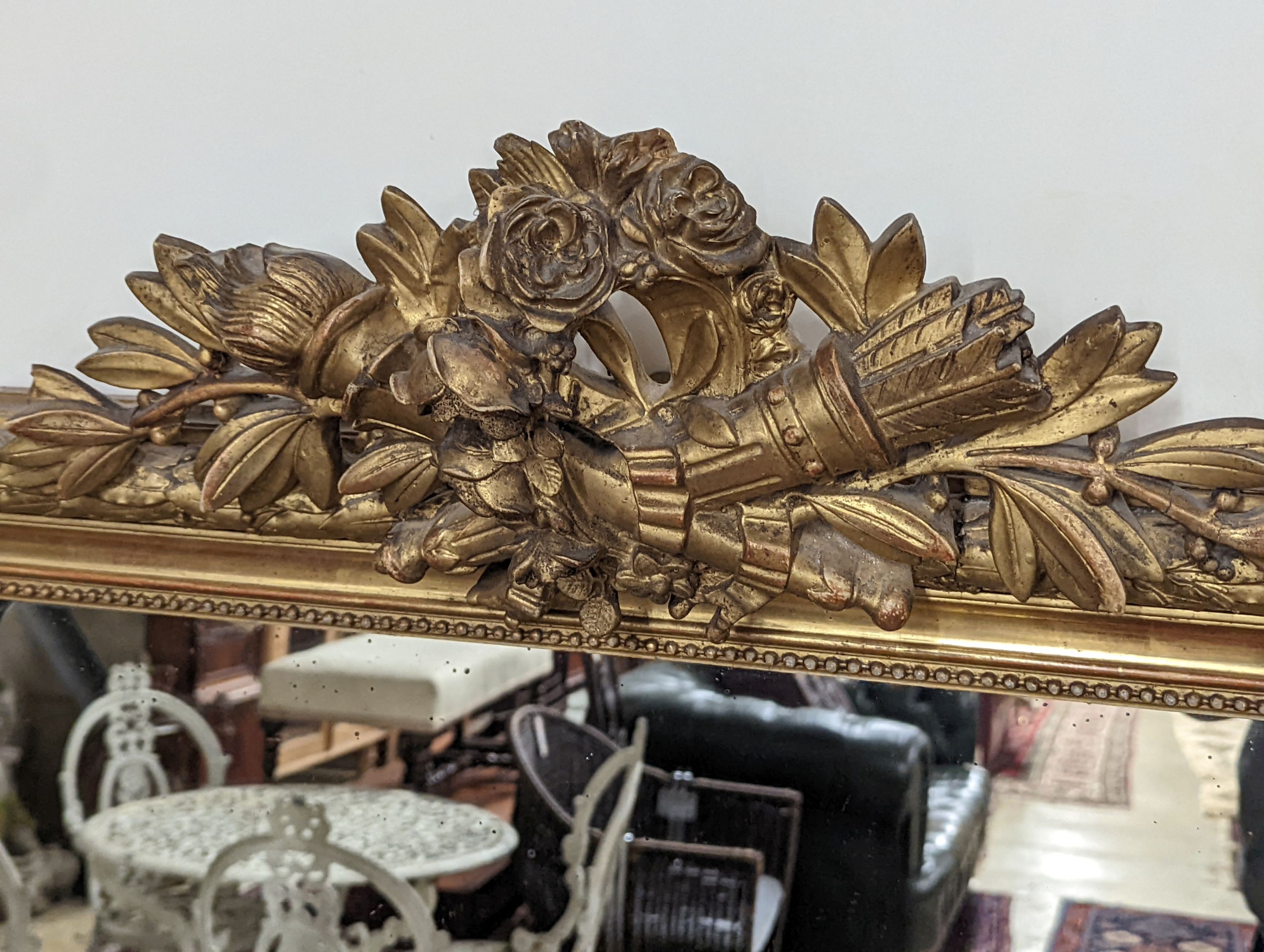 A 19th century French carved giltwood overmantel mirror, width 100cm, height 150cm